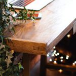 Home Office Decor - Himalayan Salt Lamp Near Laptop On Wooden Table