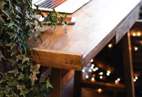 Home Office Decor - Himalayan Salt Lamp Near Laptop On Wooden Table