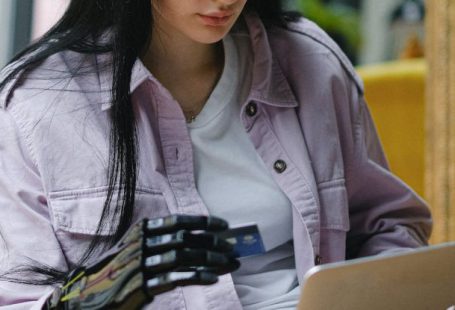 Laptop - A Woman Sitting on the Couch