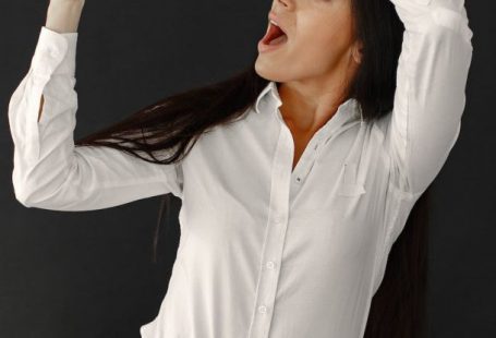 Seasonal Sales - Woman with Sale Banner on Black Background