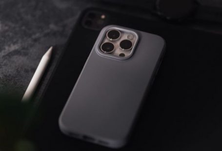 Tech Specs - A grey iphone 11 case sits on top of a table