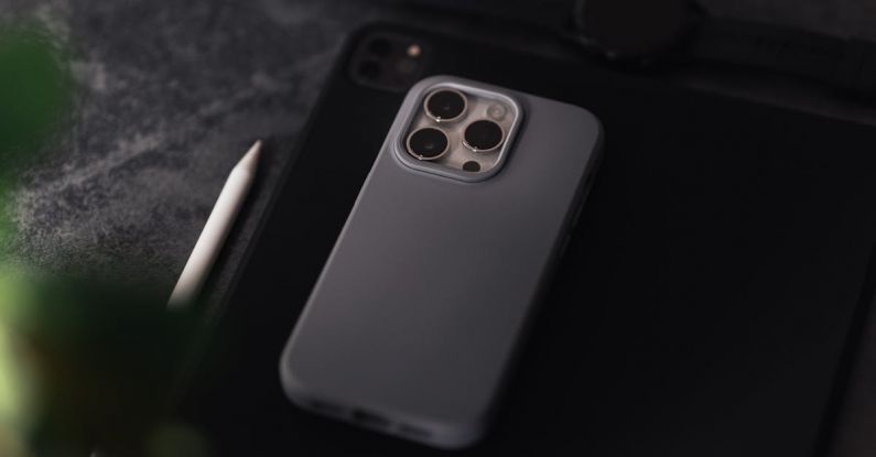 Tech Specs - A grey iphone 11 case sits on top of a table
