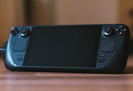 Gaming PCs - A black game controller sitting on top of a table
