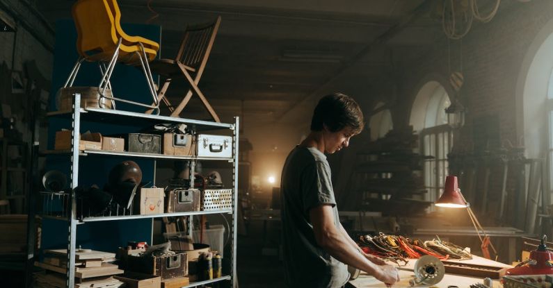 Resale - Man in Gray T-shirt Standing in Front of Table