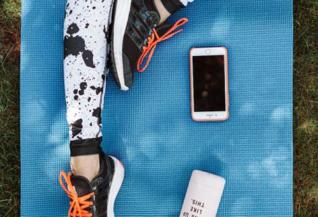 Smartphone - A Person's Legs on Yoga Mat