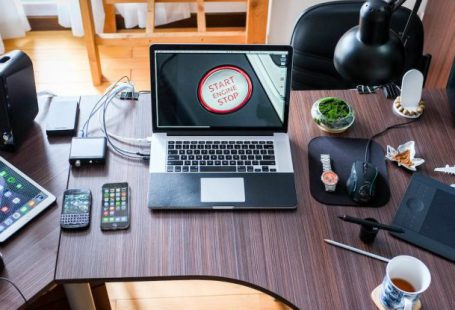 Electronics - Black and White Laptop Computer on Brown Wooden Desk