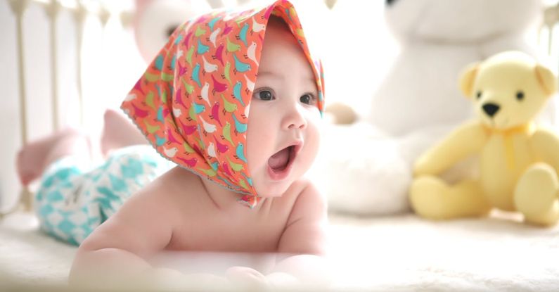 Baby Products - Toddler Wearing Head Scarf in Bed