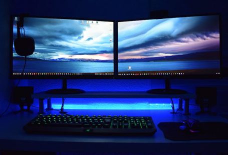 Monitors - Two Computer Flat Screen Monitors Turned On