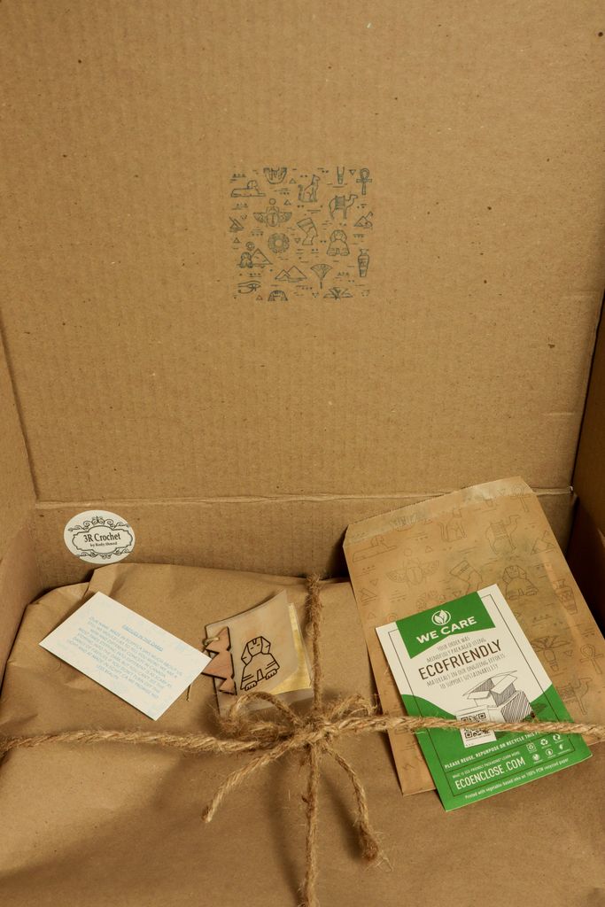 Close-up of eco-friendly packaging featuring recycled materials and sustainability labels.